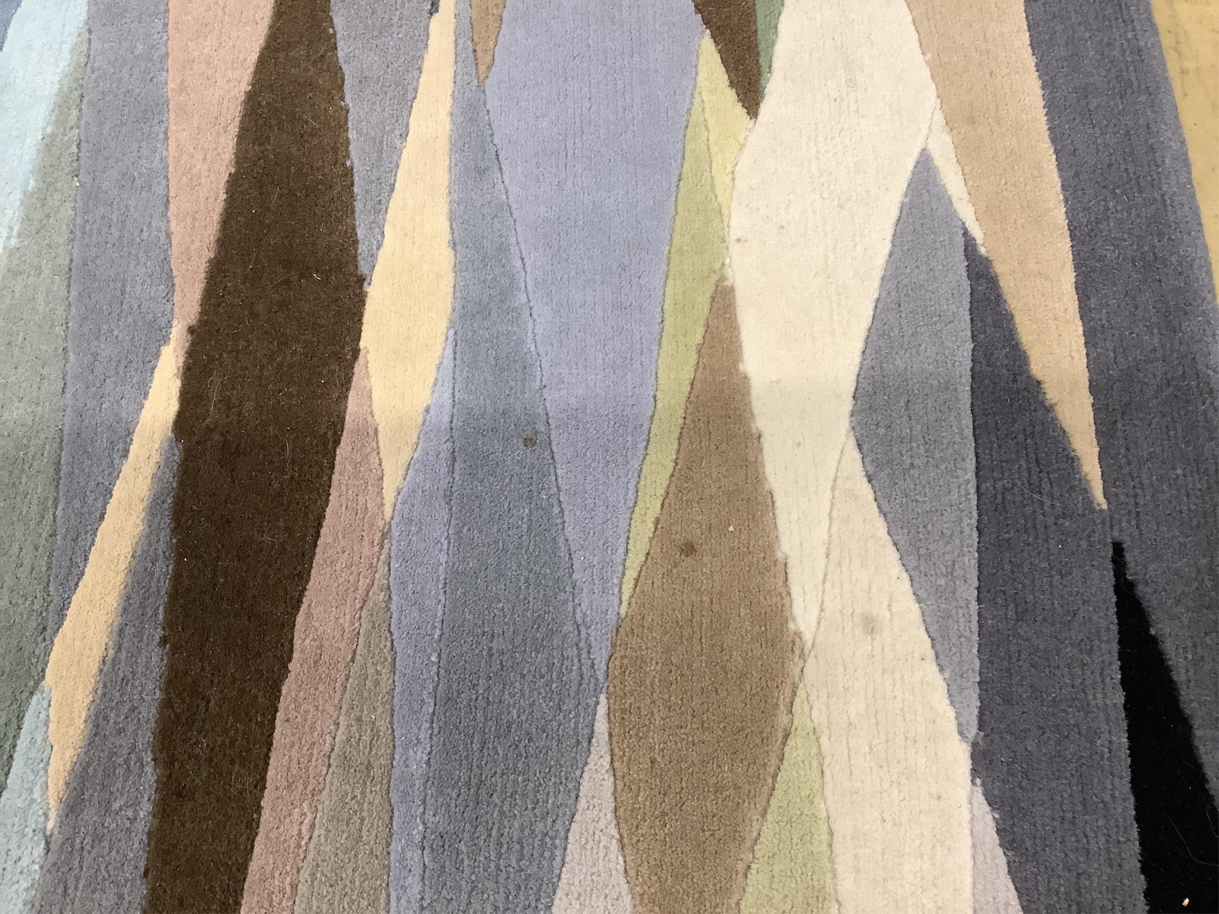 A Contemporary rug by Paul Smith, 304 x 248cm